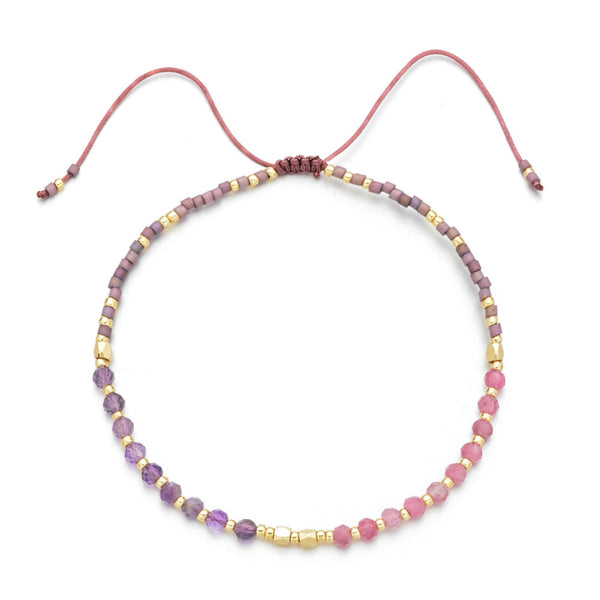 Delicate Japanese Handmade Bead Bracelets | Live Love Spa featuring purple and pink beads with gold accents and adjustable cord for a perfect wellness-inspired accessory.