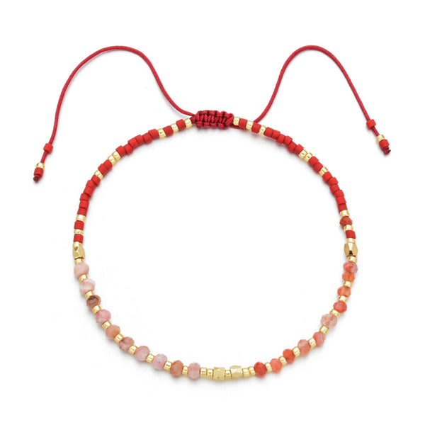 Japanese Handmade Bead Bracelets | Live Love Spa featuring a delicate adjustable red cord with alternating red, pink, and gold beads, ideal for wellness and style.