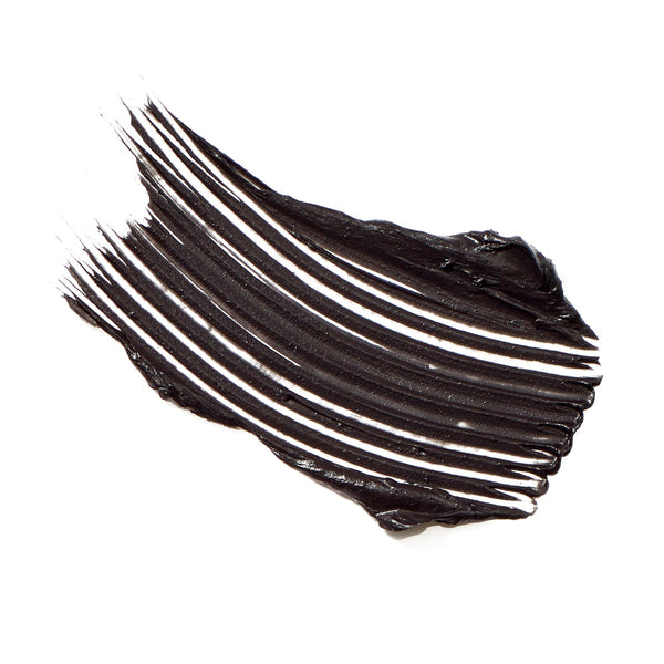 Swatch of rich black mascara texture showing smooth, voluminous strokes representing Beyond Lash Volumizing Mascara | Jane Iredale.