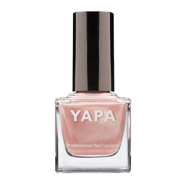 Caroline Nail Lacquer | YAPA in a soft, pearlescent pink shade with a sleek black cap, designed for professional-quality nail care and polish.