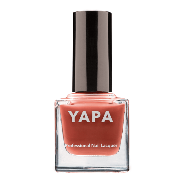 Paris Nail Lacquer | YAPA in a sleek glass bottle with a rich coral shade and black cap, designed for professional-quality nail care and vibrant color.