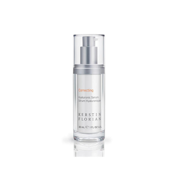 Clear glass bottle with a silver pump dispenser containing Correcting Hyaluronic Serum | Kerstin Florian, a skincare product designed for hydration and correction.