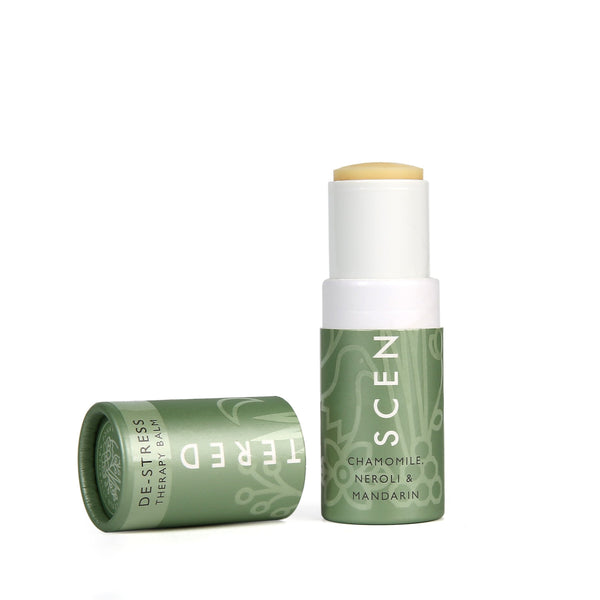 De-Stress Therapy Balm | Scentered in a green tube with chamomile, neroli, and mandarin, designed for skincare and wellness to help promote relaxation and calm.