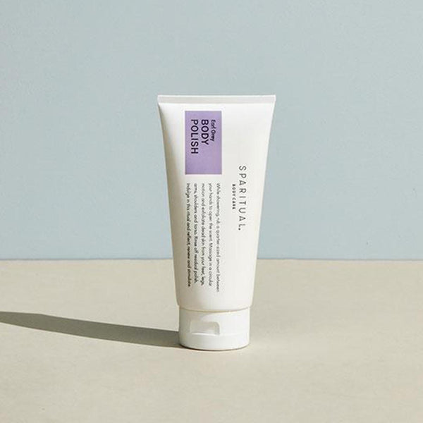Tube of Earl Grey BODY POLISH | Sparitual standing on a neutral surface, featuring minimalist packaging designed for skincare and body care wellness routines.