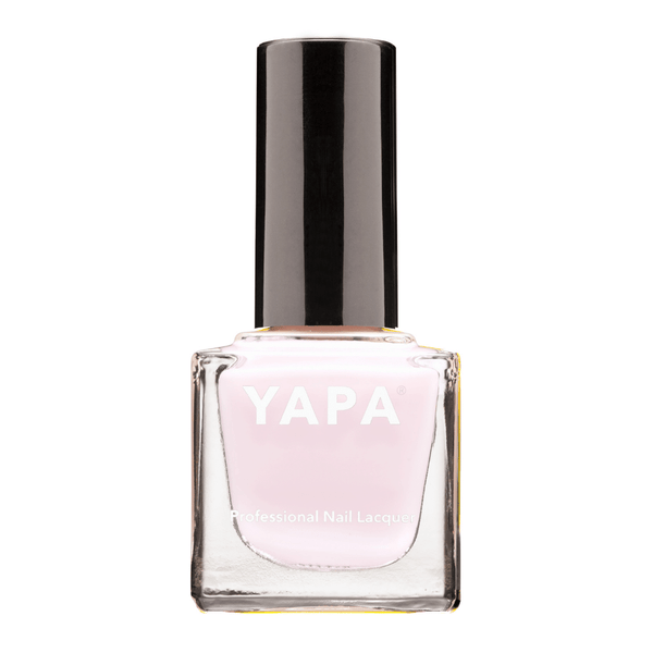 Bottle of Ella Nail Lacquer | YAPA in a soft pink shade with a sleek black cap, designed for professional nail care and polish application.