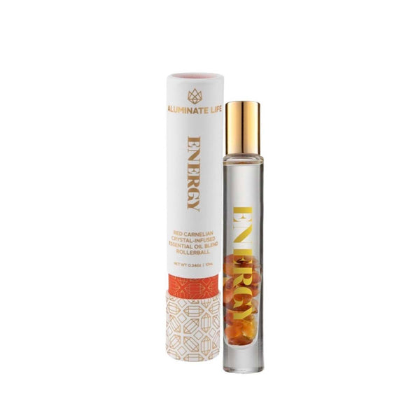 Energy Rollerball | Aluminate Life featuring a clear glass rollerball bottle with golden cap and red carnelian crystals inside, next to sleek branded packaging for wellness use.
