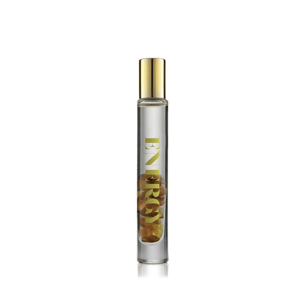 Energy Rollerball | Aluminate Life in a clear glass bottle with gold lettering and a gold cap, containing visible dried botanicals inside for wellness and body care.