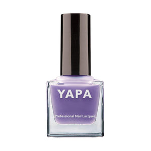 Bottle of Flora Nail Lacquer | YAPA in a soft lavender shade with a black cap, designed for professional nail care and styling.