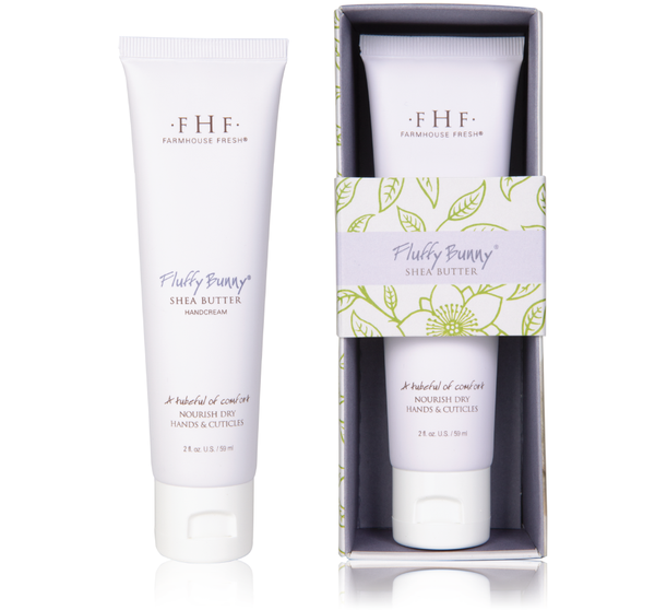 Two white tubes of Fluffy Bunny® Shea Butter Hand Cream | Farmhouse Fresh, one displayed outside and one inside a decorative box with green leaf and flower patterns.
