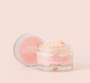 Open jar of Full Moon Dip® Iridescent Illumination Ageless Facial Mousse with Peptides + Retinol | Farmhouse Fresh shown with creamy light pink mousse and product lid beside it on a soft beige background.
