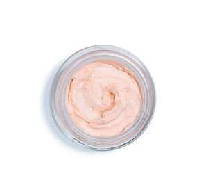 Top view of a light peach iridescent facial mousse in a clear jar, representing Full Moon Dip® Iridescent Illumination Ageless Facial Mousse with Peptides + Retinol | Farmhouse Fresh skincare product.