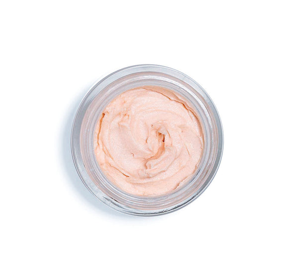 Top view of a light peach iridescent facial mousse in a clear jar, representing Full Moon Dip® Iridescent Illumination Ageless Facial Mousse with Peptides + Retinol | Farmhouse Fresh skincare product.