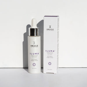 ILUMA intense facial illuminator | IMAGE Skincare product bottle with dropper next to its matching white and purple packaging, displayed on a white surface.