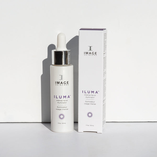 ILUMA intense facial illuminator | IMAGE Skincare product bottle with dropper next to its matching white and purple packaging, displayed on a white surface.