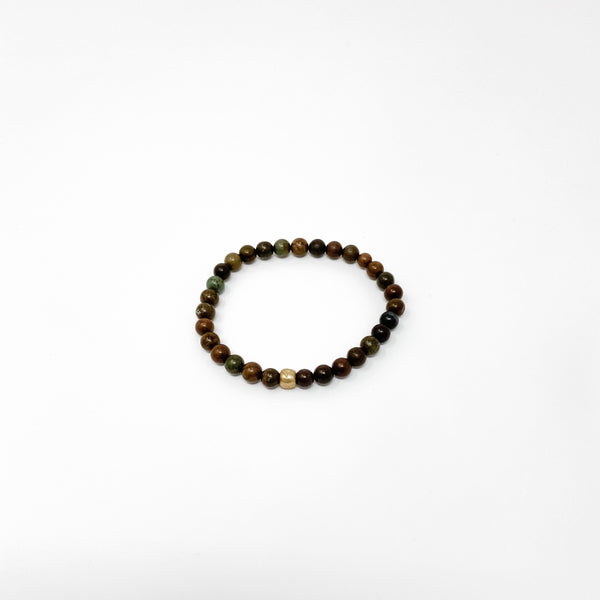 Assorted Satya Bracelets | Satya featuring a delicate circle of polished multicolored beads with natural earthy tones on a clean white background.