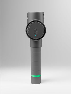 Hypervolt 2 | Hyperice in dark gray standing upright with power button and LED indicators visible, designed as a recovery tool for wellness and body care.