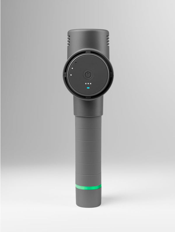 Hypervolt 2 | Hyperice in dark gray standing upright with power button and LED indicators visible, designed as a recovery tool for wellness and body care.