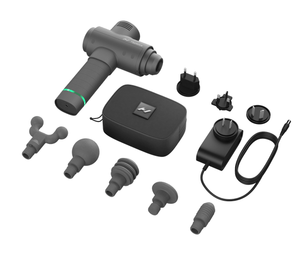 Hypervolt 2 | Hyperice massage device with multiple interchangeable heads, travel carrying case, and international power adapters for targeted muscle recovery and wellness.