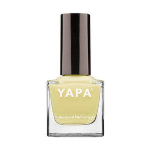 Jasmine Nail Lacquer | YAPA in a pale yellow shade with a sleek black cap, presented in a clear square glass bottle for professional nail care.