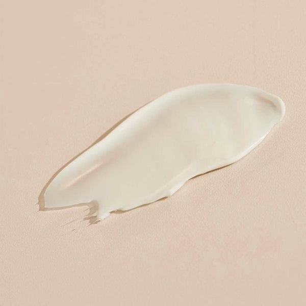 Smooth, creamy texture of Jasmine Tuberose BODY CRÈME | Sparitual on a soft beige background, highlighting rich skincare for body care and wellness.