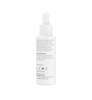 White dropper bottle labeled with skincare product instructions and branding for Luminous Serum | Skin Moderne, designed for targeted skin care and whitening benefits.