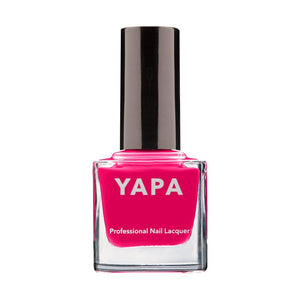 Bright pink professional nail lacquer bottle labeled YAPA with a sleek black cap, part of the Liz Nail Lacquer | YAPA collection.