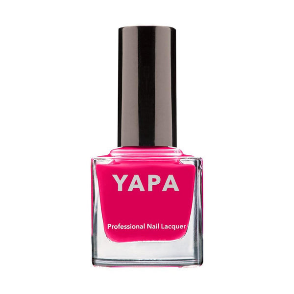 Bright pink professional nail lacquer bottle labeled YAPA with a sleek black cap, part of the Liz Nail Lacquer | YAPA collection.