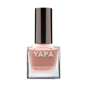 Bottle of Meghan Nail Lacquer | YAPA in a soft nude shade with a sleek black cap, designed for professional-quality nail care and beauty.