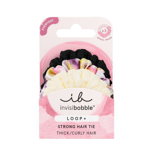 Package of LOOP 3 pc | invisibobble strong hair ties for thick and curly hair in black, tie-dye, and cream colors displayed on a pink and white card.