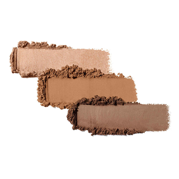 Three swatches of neutral brown shades of pressed powder eyeshadow arranged side by side, showcasing the texture and color variety of Purepressed Eye Shadow Triple | Jane Iredale.