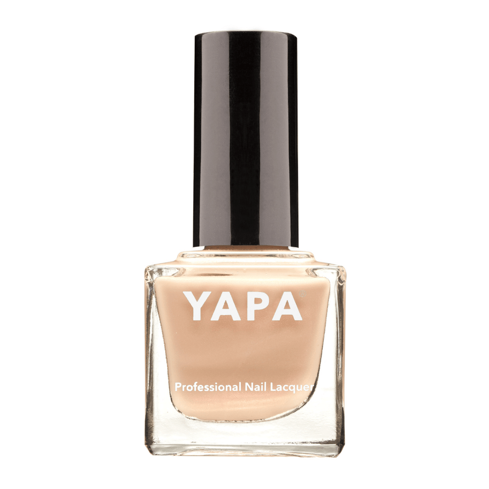 Bottle of Rachel Nail Lacquer | YAPA in a soft nude beige shade with a black cap, designed for professional-quality nail care and beauty.