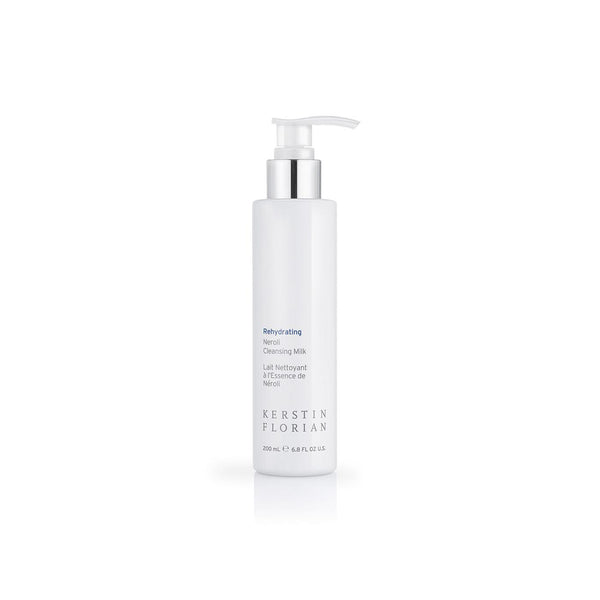 White pump bottle of Rehydrating Neroli Cleansing Milk | Kerstin Florian, a skincare product designed for gentle and effective facial cleansing and hydration.