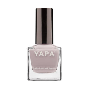Sarah Nail Lacquer | YAPA in a soft mauve shade, presented in a clear glass bottle with a sleek black cap for a professional nail care look.