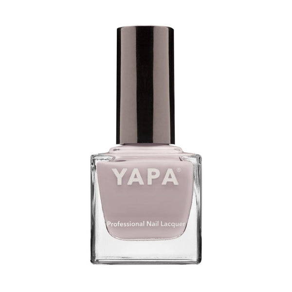 Sarah Nail Lacquer | YAPA in a soft mauve shade, presented in a clear glass bottle with a sleek black cap for a professional nail care look.