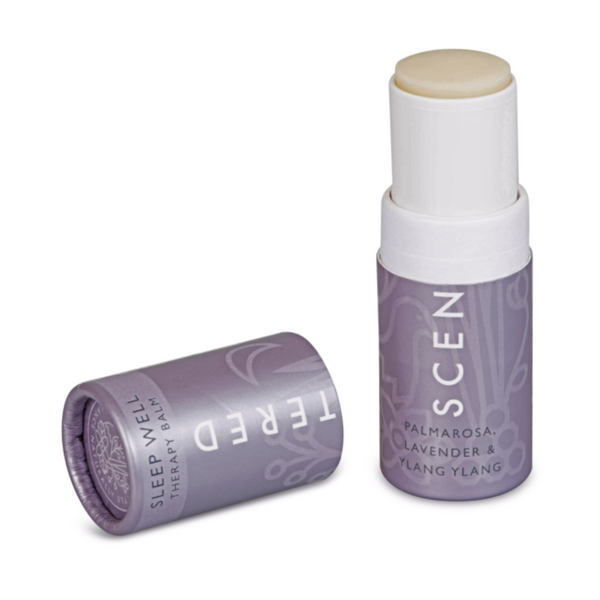 Open tube of Sleep Well Therapy Balm | Scentered in light purple packaging with natural balm stick exposed, designed for skincare and wellness support.