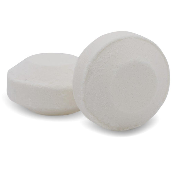 Two white round shower steamer tablets designed for aromatherapy and wellness, labeled as Breathe Shower Steamer | Primal Elements.