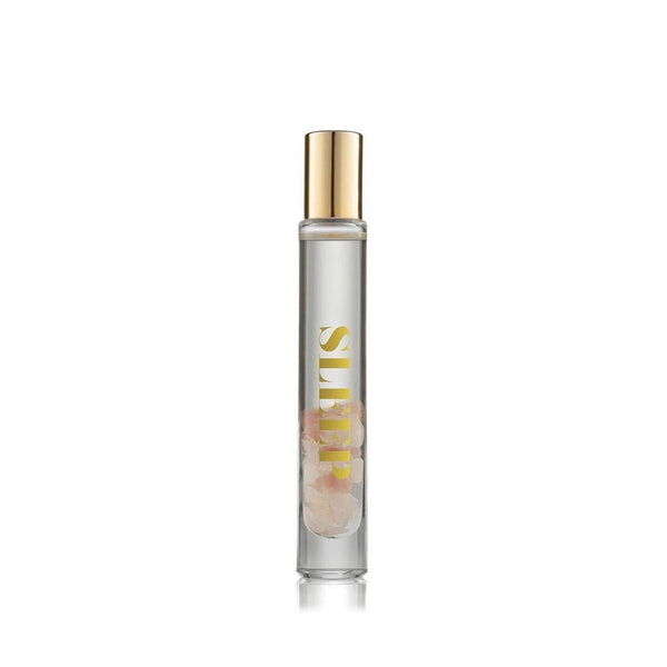 Sleep Essential Oil Rollerball | Aluminate Life in a clear glass bottle with gold cap, containing a transparent liquid and rose quartz crystals inside, designed for wellness and relaxation.
