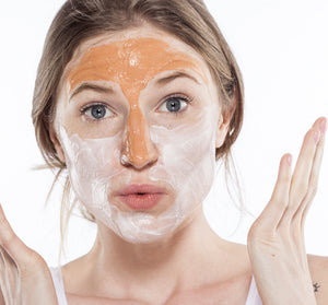 Young woman applying Splendid Dirt® Nutrient Mud Mask with Organic Pumpkin Puree | Farmhouse Fresh on her face, demonstrating skincare and wellness routine.