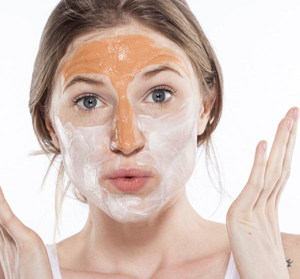 Young woman applying Splendid Dirt® Nutrient Mud Mask with Organic Pumpkin Puree | Farmhouse Fresh on her face, demonstrating skincare and wellness routine.