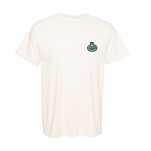 Ivory-colored comfy tee featuring a small embroidered green bunny design, designed for casual wellness and relaxation with the Spa Bunny Comfy Tee | Lucky Owl.