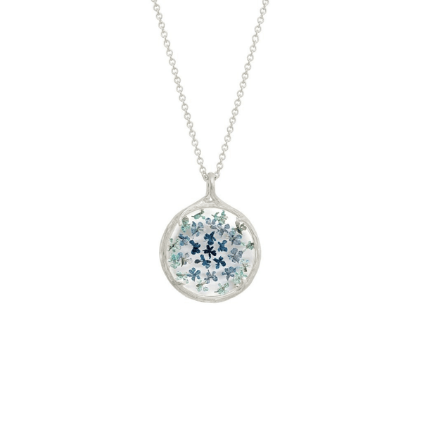 Small Ombre Botanical Necklace | Catherine Weitzman Jewelry featuring delicate blue and green floral designs encased in a round silver pendant on a fine chain.