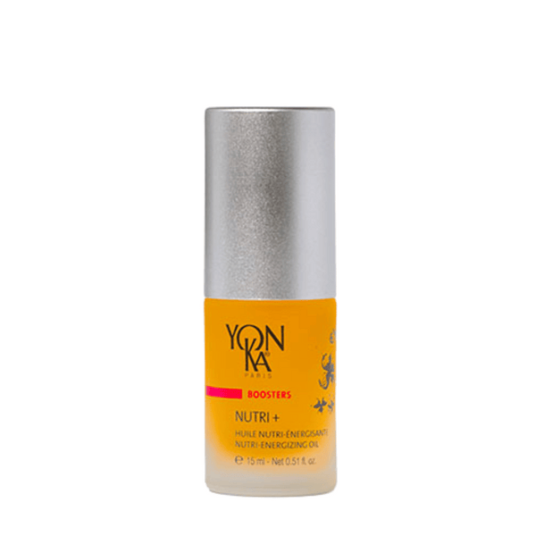 Small bottle of Booster Nutri+ | Yon-Ka Paris, a skincare nutri-energizing oil with a silver cap and amber liquid inside.