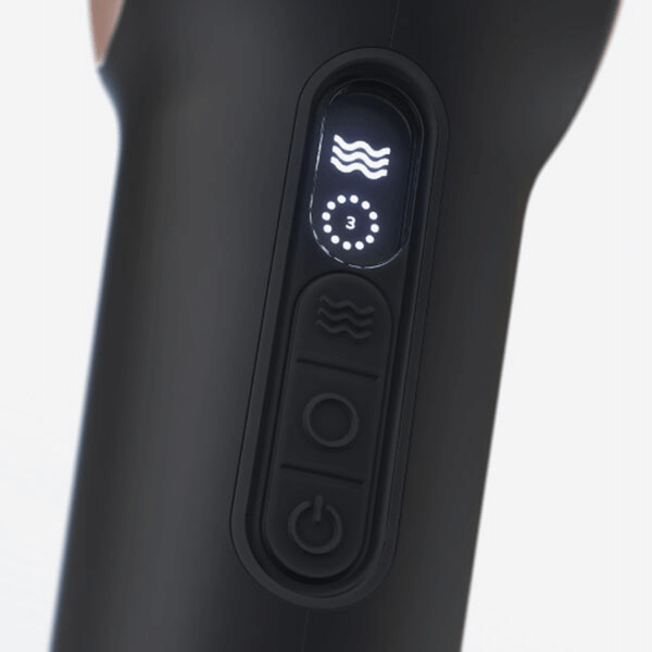 Close-up of control panel on TheraFace PRO | Therabody featuring power button and vibration intensity display for skincare and wellness recovery tools.