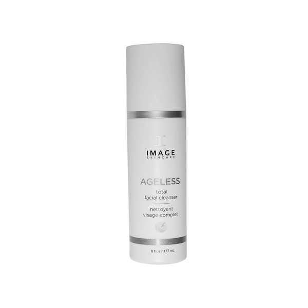 Bottle of AGELESS total facial cleanser | IMAGE Skincare with minimalist white design and silver accents, highlighting skincare and facial cleansing features.