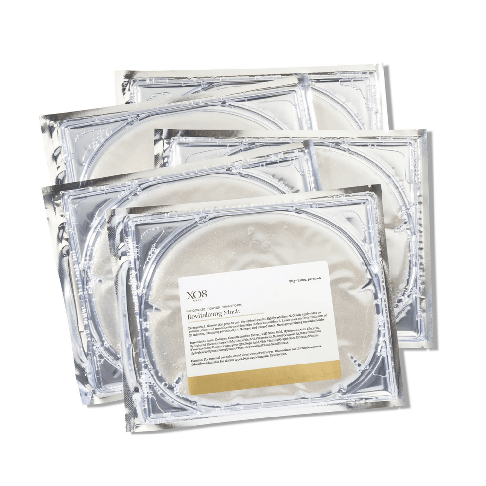 Four clear gel sheet masks in individual silver foil packets, labeled Revitalizing Mask | XO8 Cosmeceuticals, designed for skincare and wellness treatment.