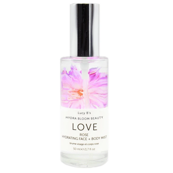 Clear glass bottle of Hydra Bloom Love Rose Face and Body Mist | Hydra Bloom with pink floral design and silver spray cap, a hydrating skincare product.