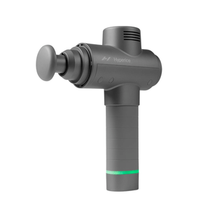 Hypervolt 2 | Hyperice percussion massage device in gray with ergonomic handle and round attachment, designed for muscle recovery and wellness care.