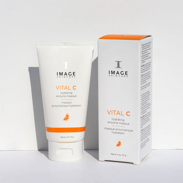 VITAL C hydrating enzyme masque | IMAGE Skincare tube and box packaging displayed on a white surface, featuring clean white and orange design for skincare product.