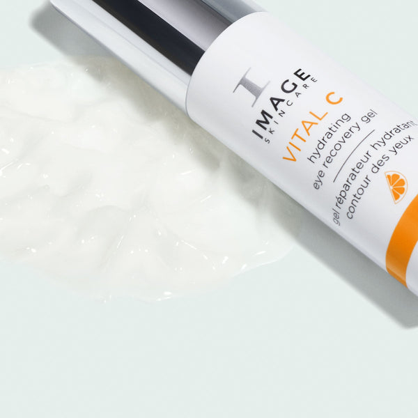 VITAL C hydrating eye recovery gel | IMAGE Skincare tube with clear gel texture on white surface, highlighting moisturizing skincare for delicate eye area.