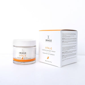 Jar and box packaging of VITAL C hydrating overnight masque | IMAGE Skincare displayed on a white background, showcasing skincare product designed for overnight hydration and skin renewal.